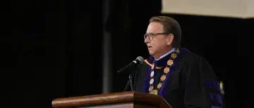 President Delaney wearing Chain of Office at past Commencement