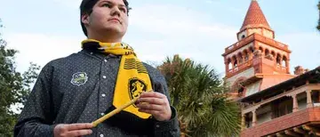 HPW 2022 - Student standing in front of the Ponce wearing Harry Potter attire.