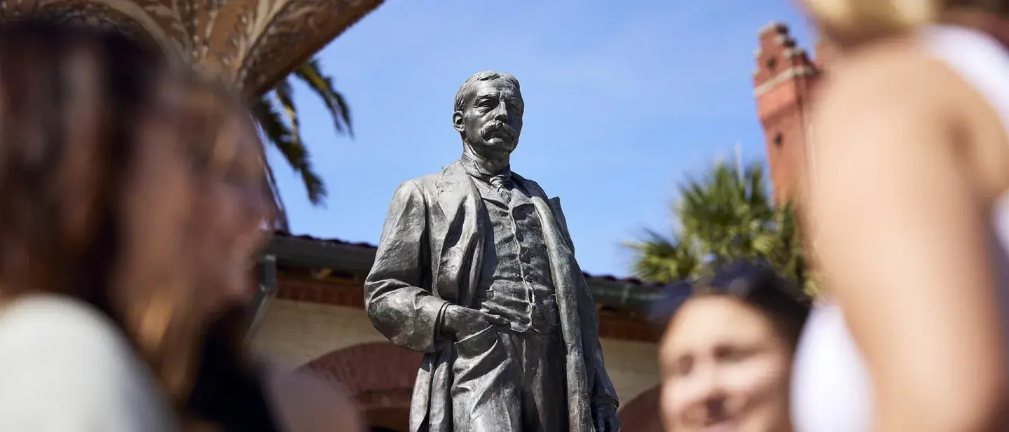 Students in front of the Henry Flagler statue