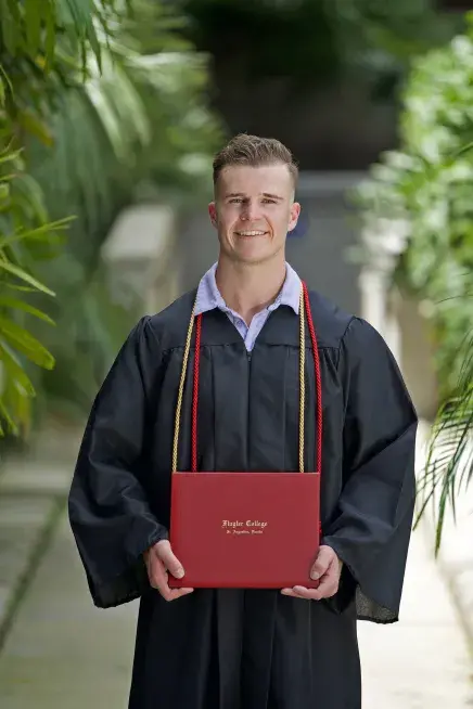 Shane holding diploma