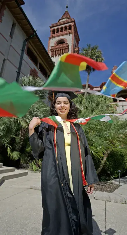 Alana holding string of flags