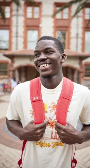 A young man with a backpack