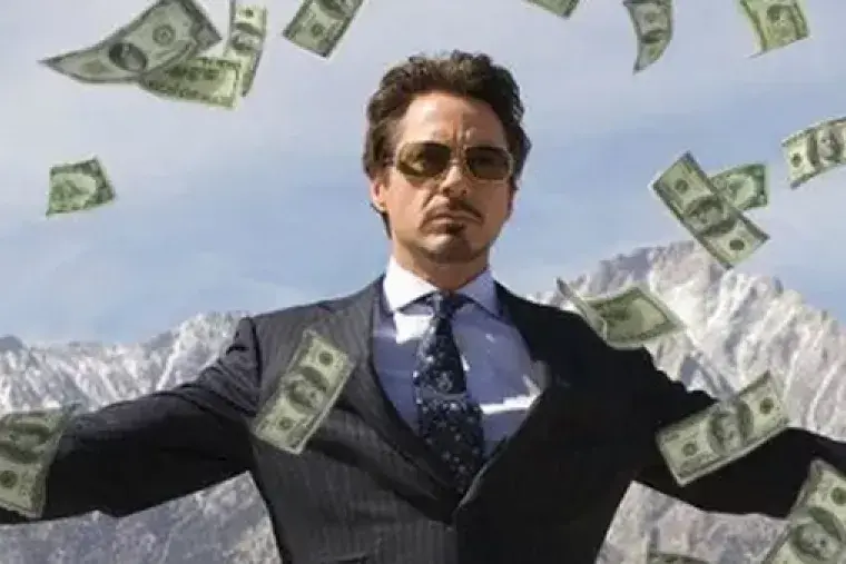 Robert Downey Junior surrounded by money