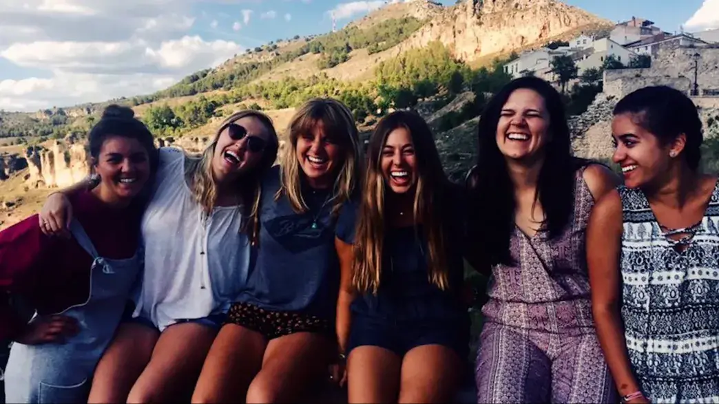 A group of Flagler College students smiles on a study abroad to Spain.
