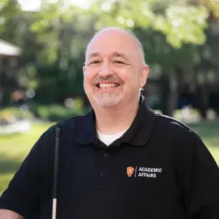 Flagler College staff member Phil Pownall is shown.
