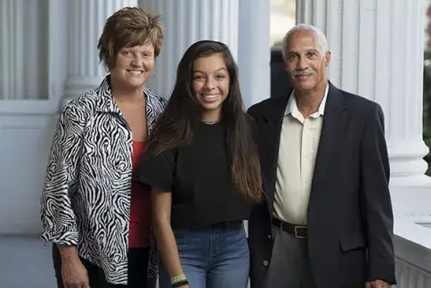female student with her family after graduating from Flagler in December